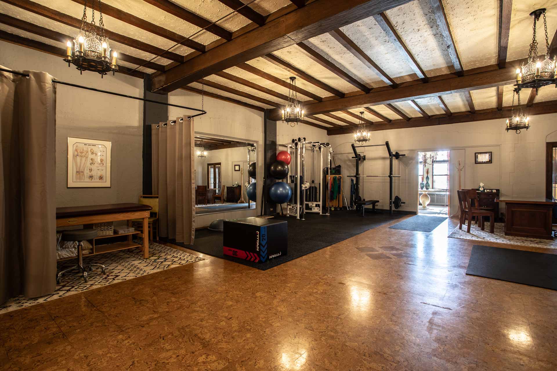 A wide angle shot highlighting the weight training area at MKE Physical Therapy.